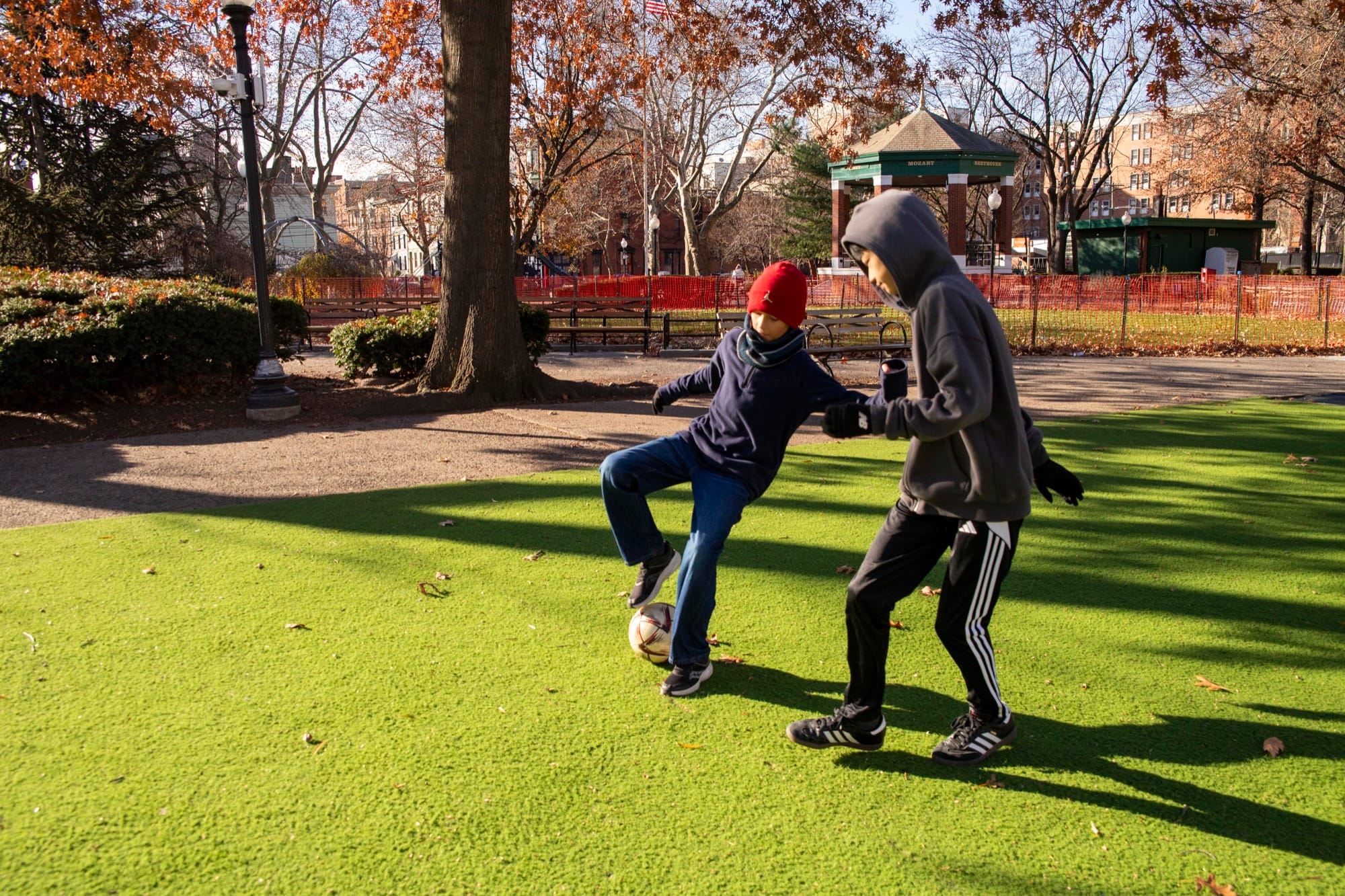 Hudson School student sprinting across an outdoor park field