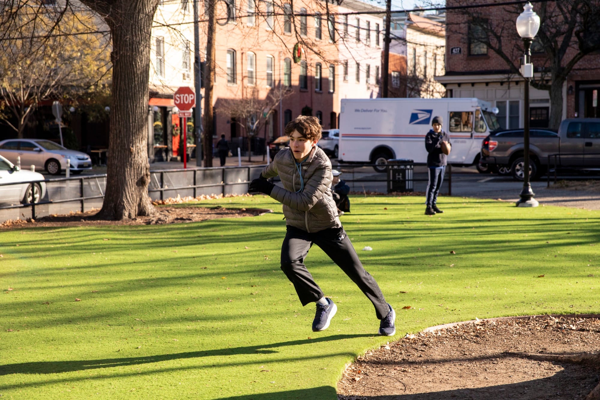 A Hudson middle school student running during outdoor athletics