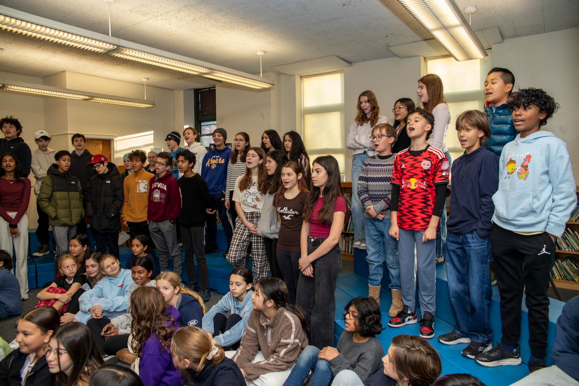 Diverse group of Hudson School students smiling together on campus