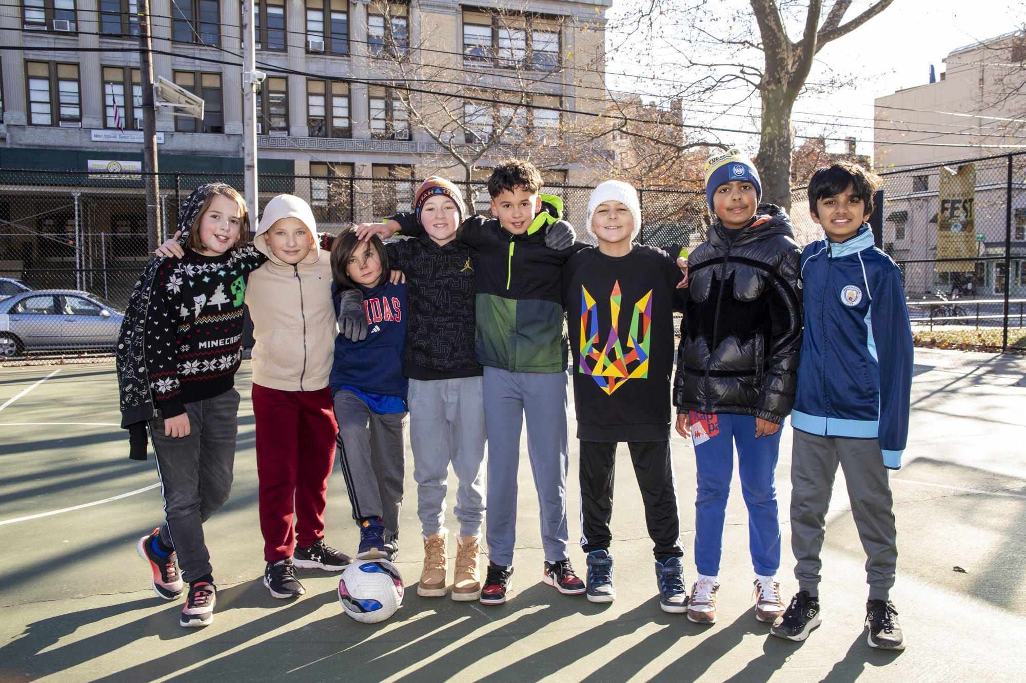 Large group of teens standing outdoors together