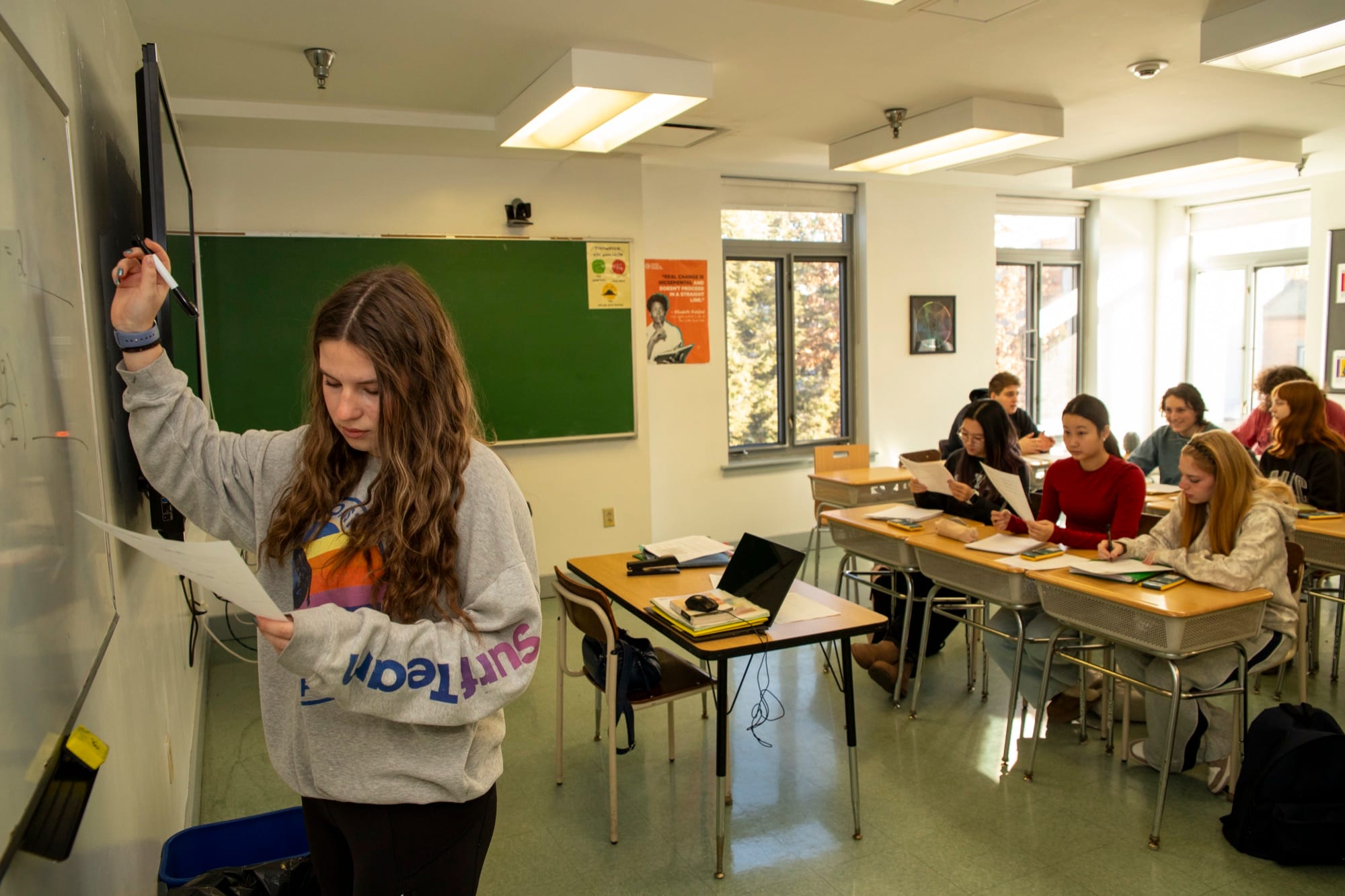 A Hudson School teacher working closely with students