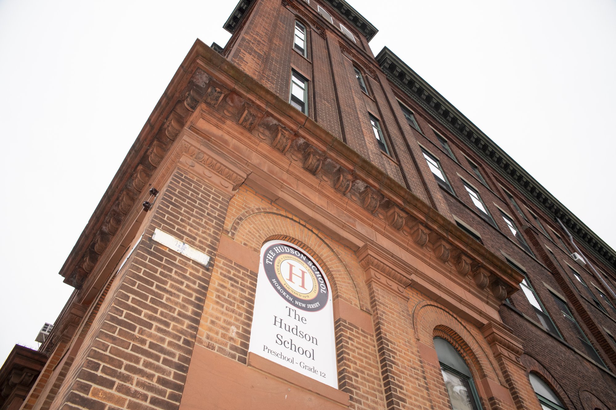 Hudson School building with globe sculpture