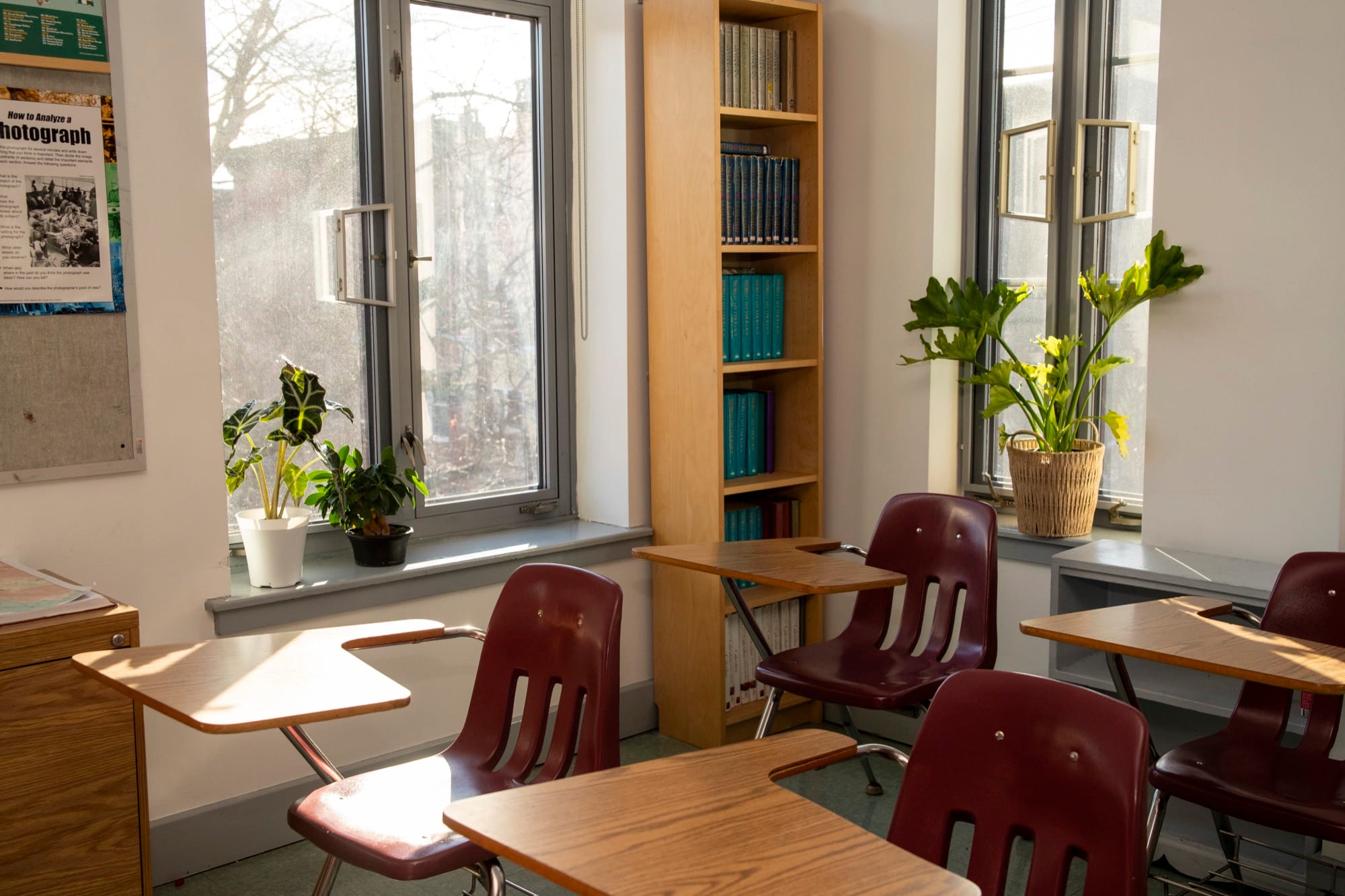 Hudson School student working at a desk in a warm classroom