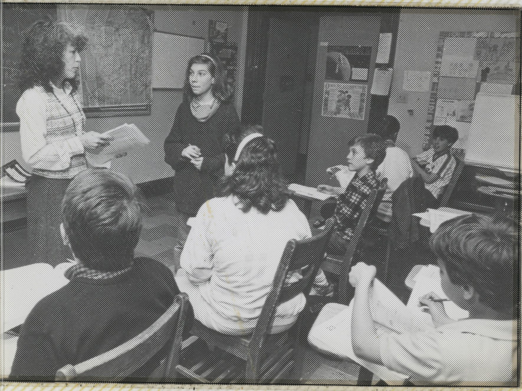 A Hudson School teacher leading a small seminar-style class discussion, in an archival photo.